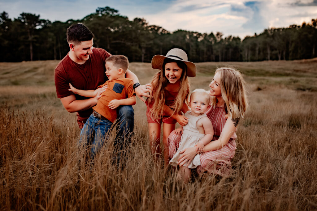 Laughing family dress cohesively photo session